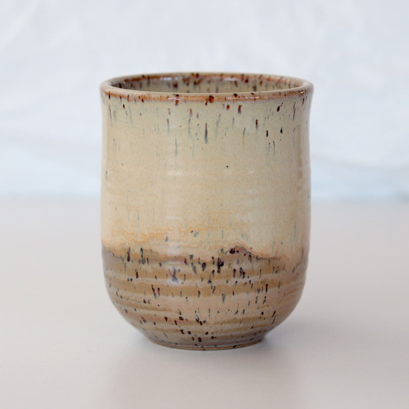 Pottery-ceramic-beige-brown-mug-stonewware-no-handle-onthetable