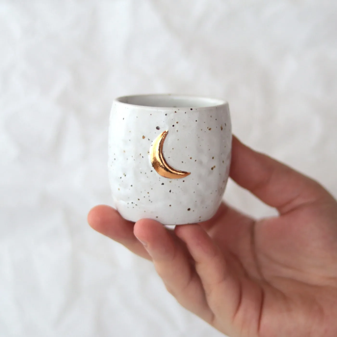 Handmade stoneware pinched espresso cup with gold moon - Vary on hand