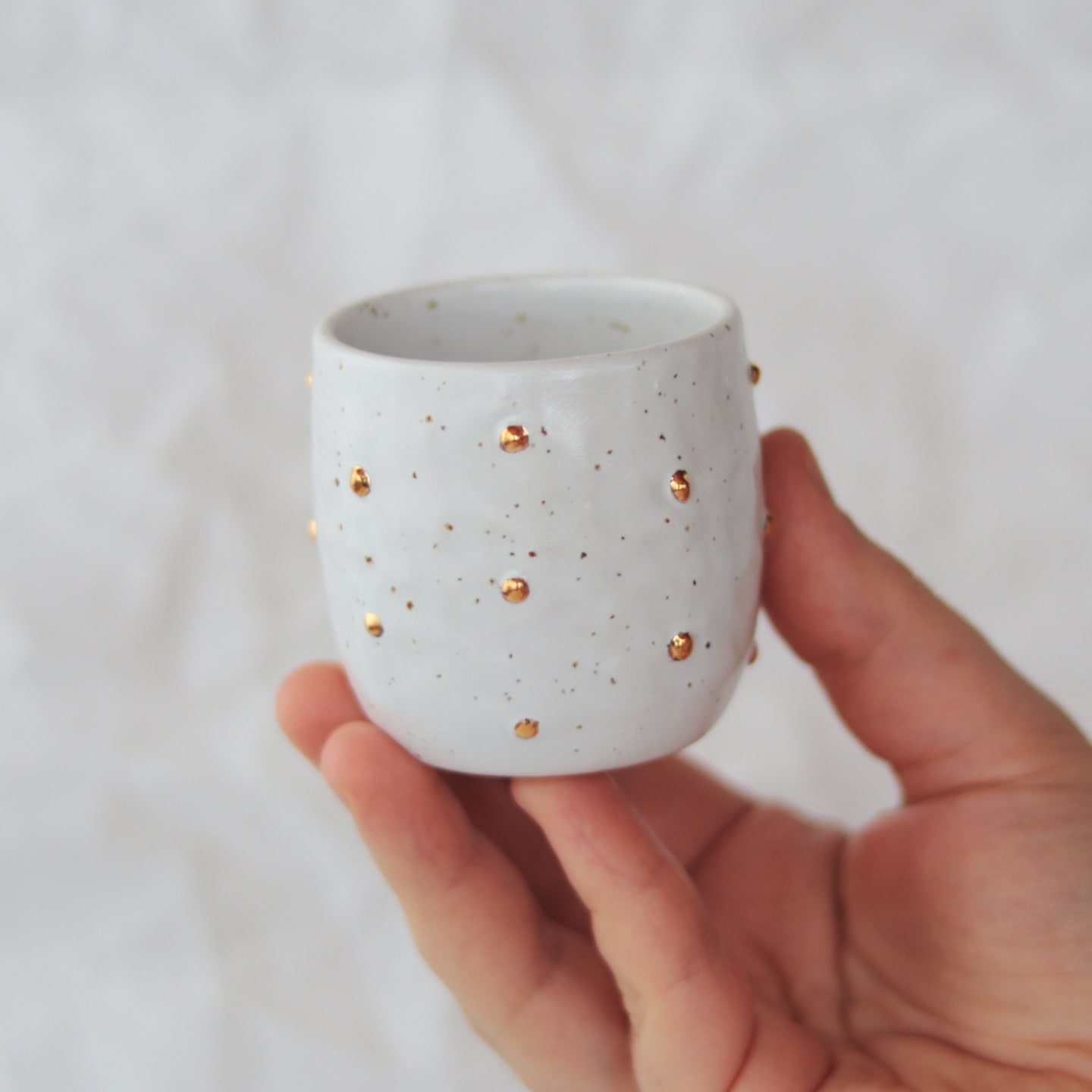 espresso-cup-with-gold-polka-dots-white-held espresso-cup-with-gold-polka-dots-white-held