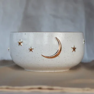 Handmade speckled white stoneware bowl with gold crescent moon and star details — front view — Seyma Ates Studio