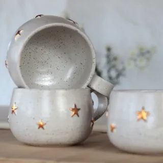 Handmade stoneware mugs with gold stars stacked, speckled white clay, made in Istanbul