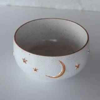 Handmade white stoneware bowl with gold moon and stars, speckled clay, made in Istanbul